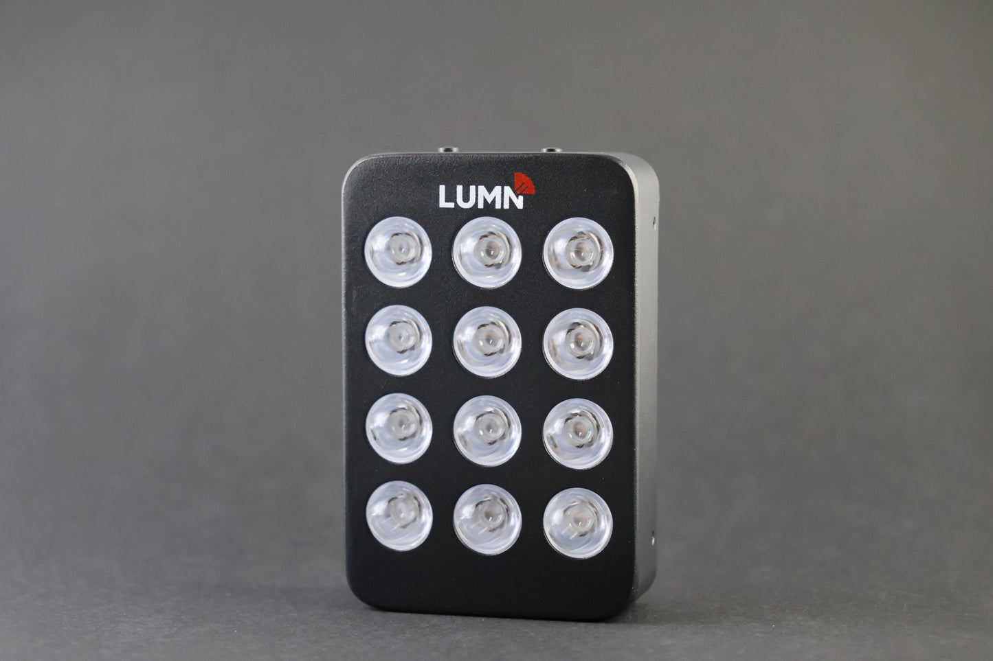 LUMN Mini handheld red light therapy device with carrying case