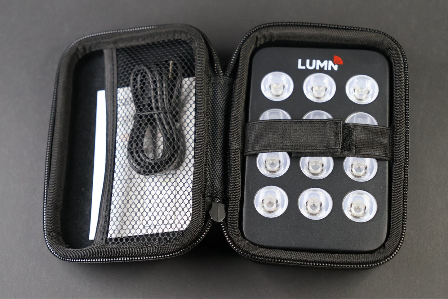 LUMN Mini handheld red light therapy device with carrying case
