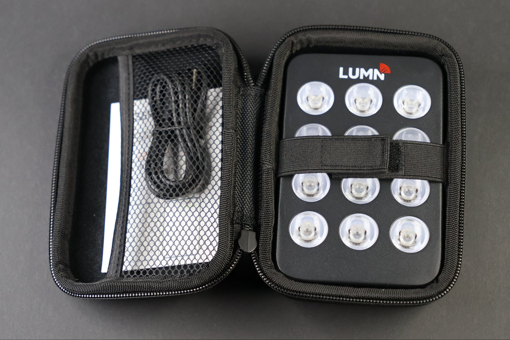 LUMN Mini handheld red light therapy device with carrying case