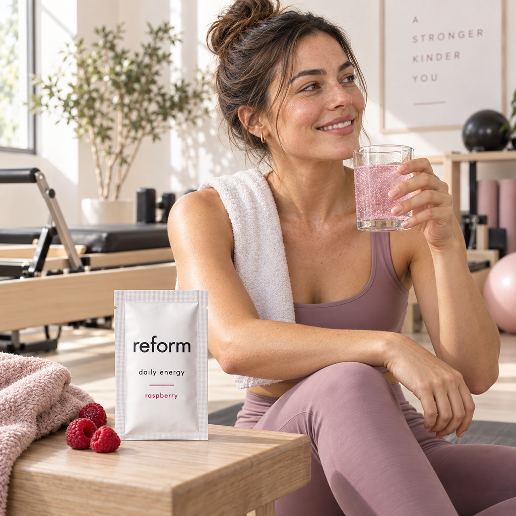 Woman enjoying Reform Daily Energy after a Pilates session
